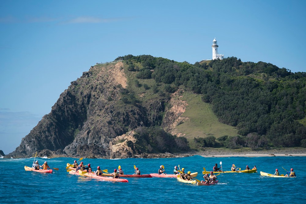 a group of people on a boat in a large body of water